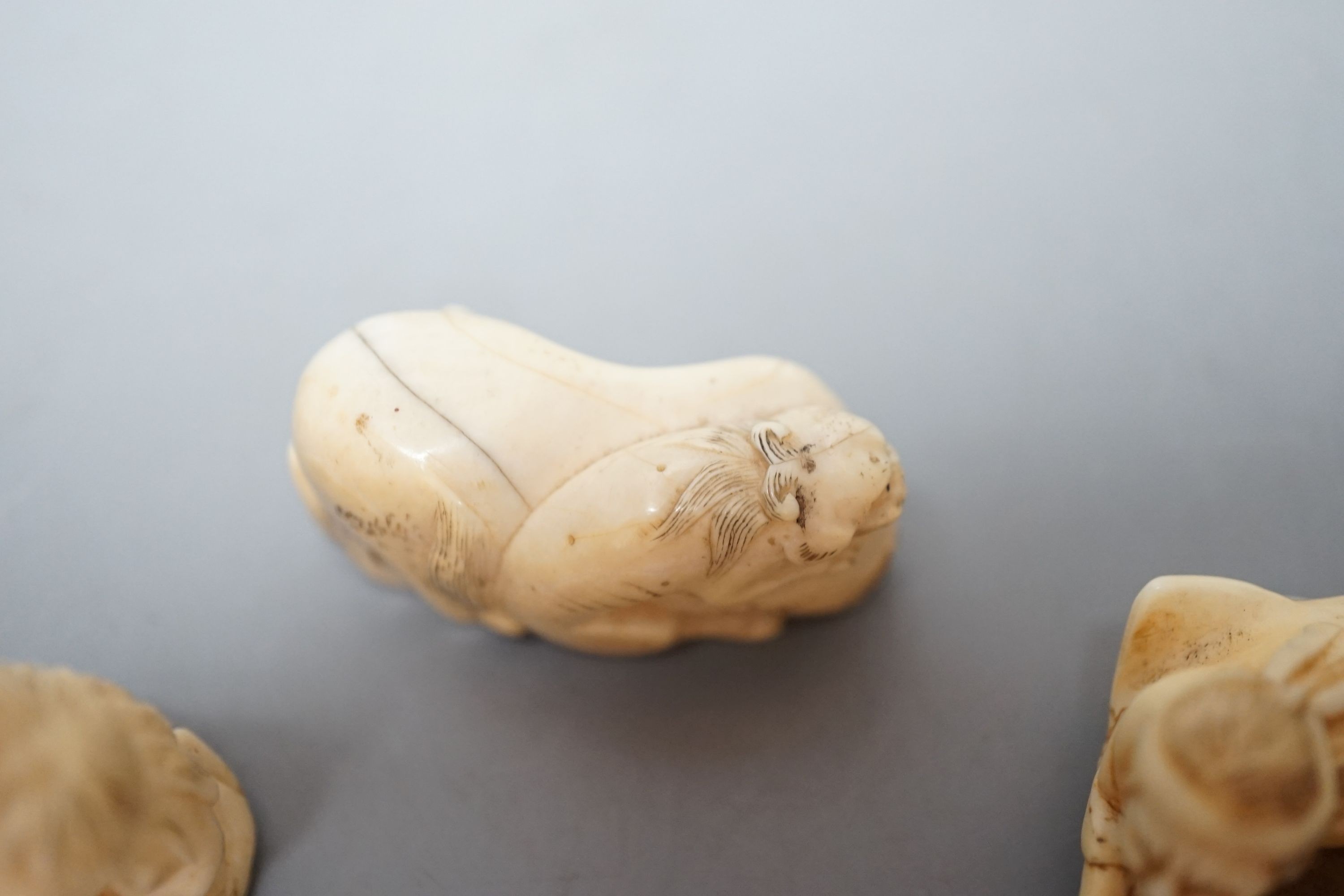 A collection of eight Japanese Ivory and bone Netsuke and okimono, 19th/early 20th century